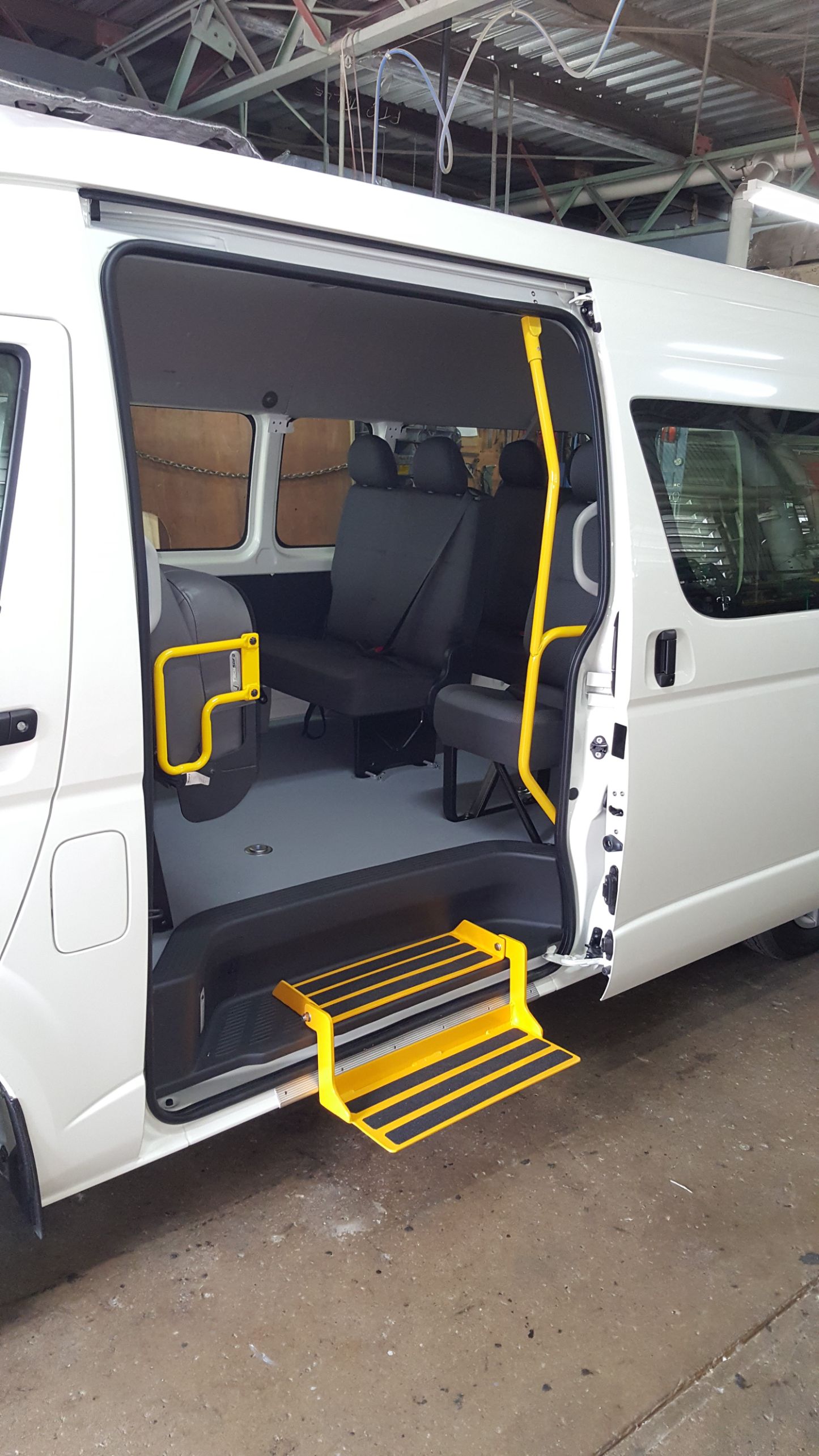 Manual Fold down step with Grab rails on fold up seat (2)
