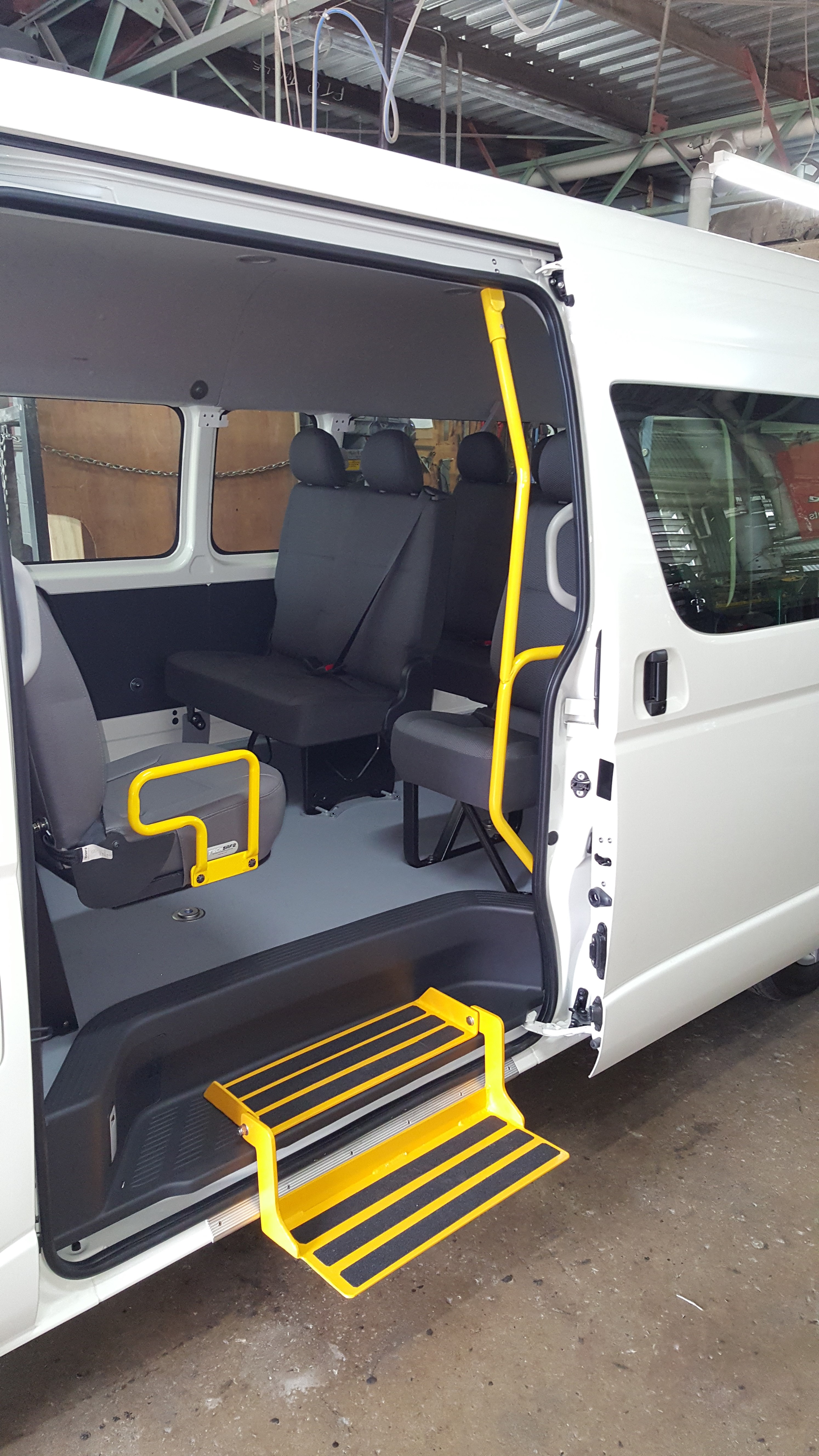 Manual Fold down step with Grab rails on fold up seat